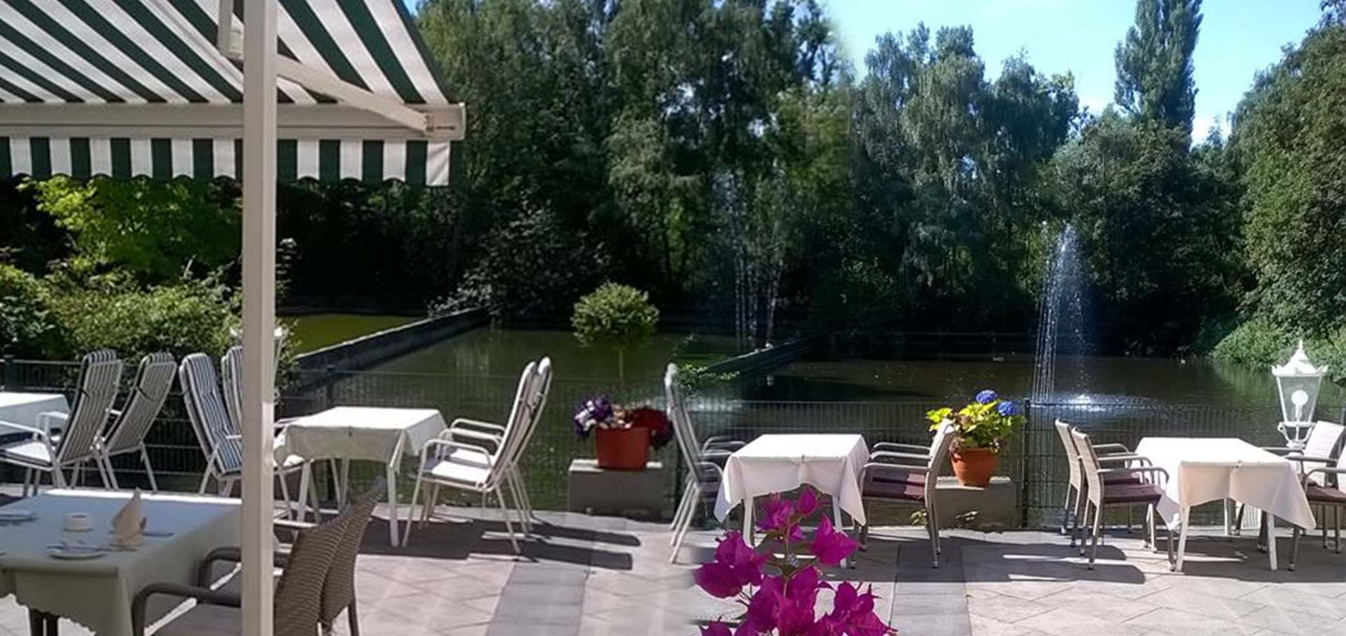 Terrasse am ehemaligen Freibadbecken mit Springbrunnen